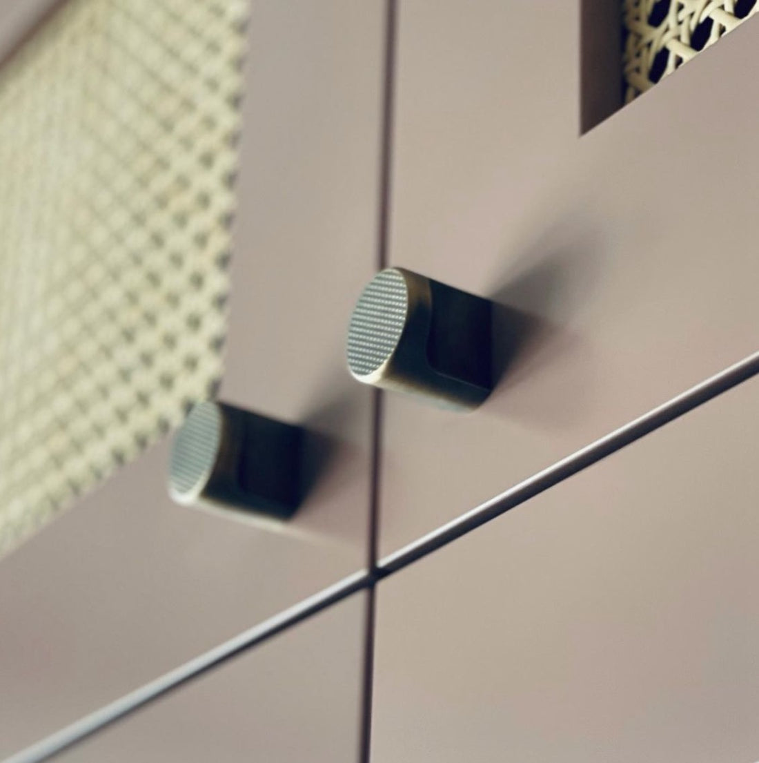 Gary Banks Carpentry, brushed brass pull knobs on cane webbed cabinetry. Modern pull knobs for cabinetry