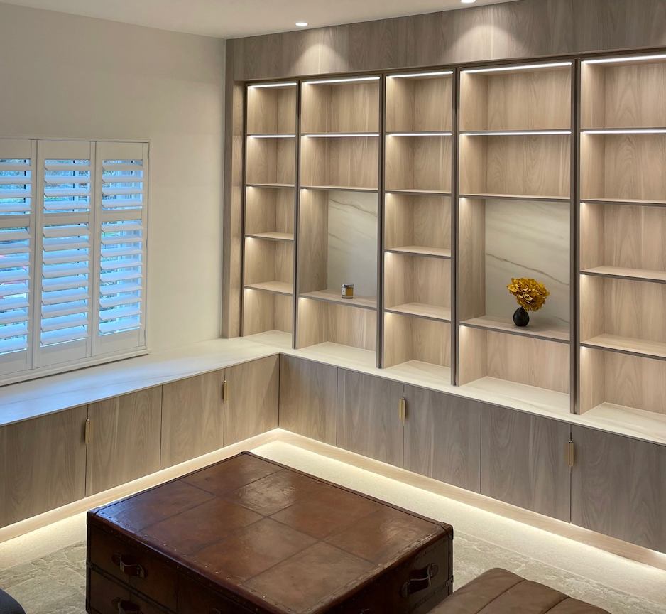 Ivychurch flat knurl overhang pull handle in satin brass on pale grey media unit by Timber Roc DJ carpentry