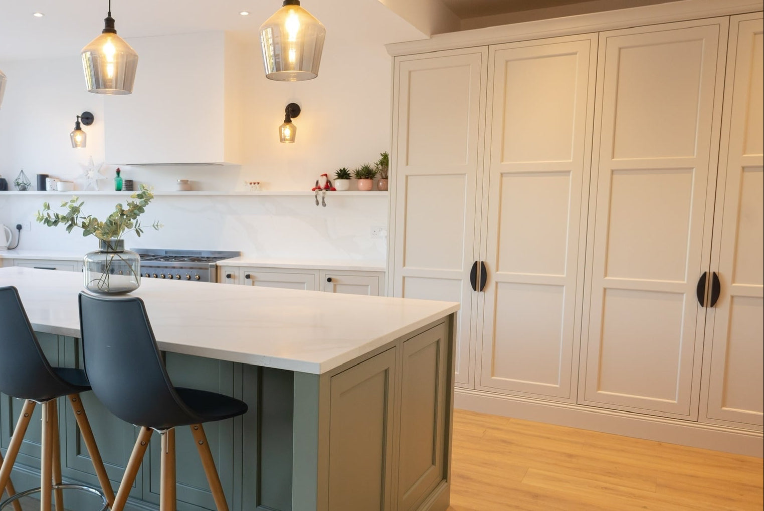 ceramic black crescent pull knurled handles on kitchen cabinetry 
