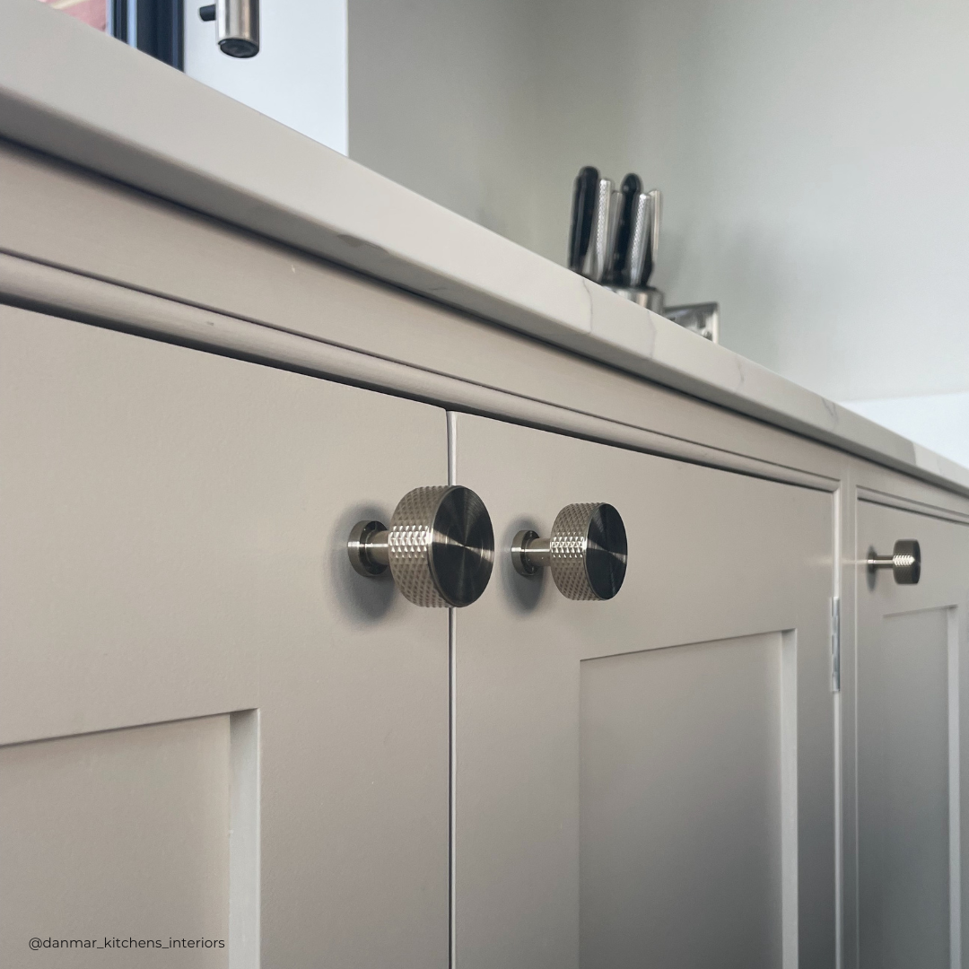 Cranbrook satin nickel knurled pull handle on grey kitchen in Yalding. Kitchen design by Alex Bayliss at Danmar Interiors in West Malling. Photography by Georgie Commons Freelance