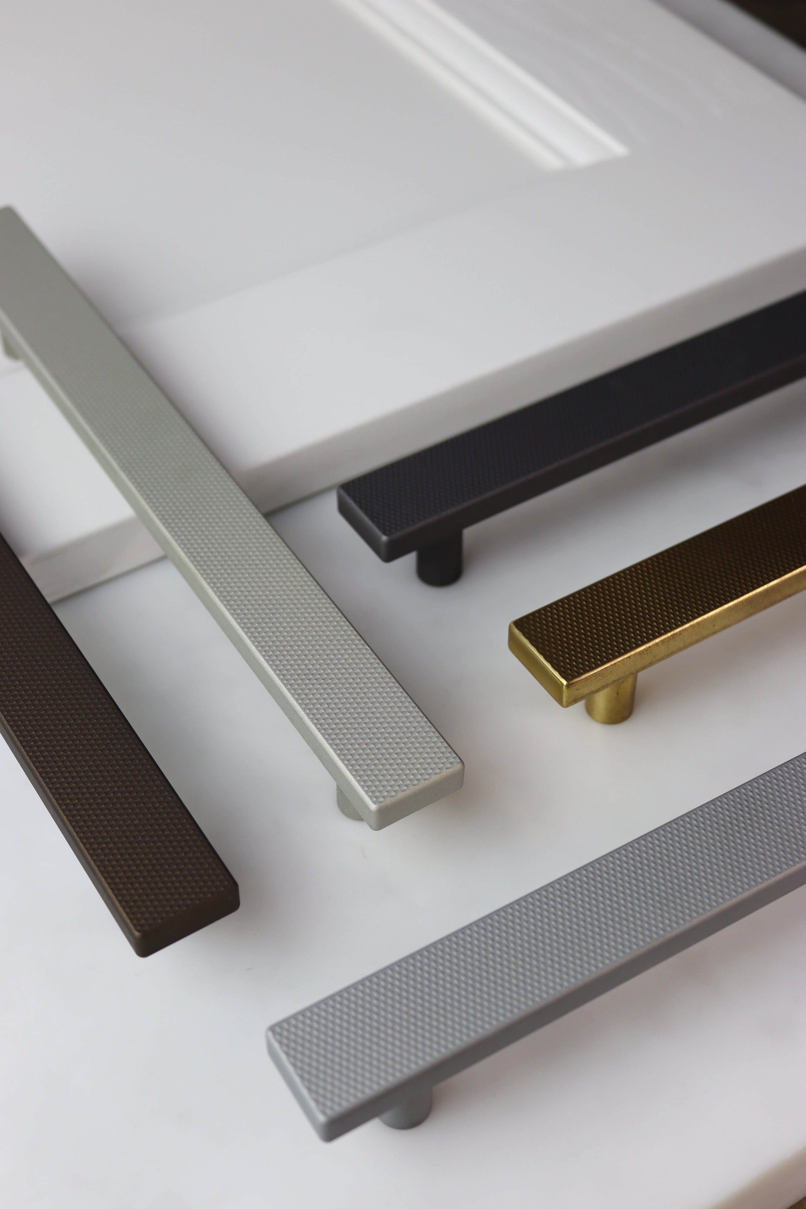 Roseland collection at Clemo + Finch. Flat knurled rectanglular brass handles for kitchens and bedrooms 