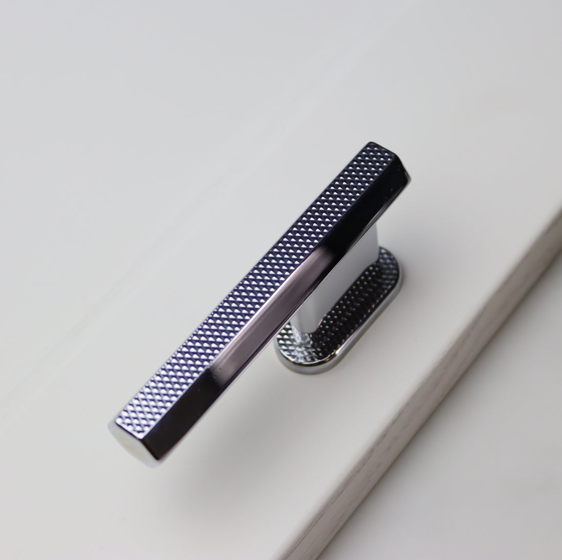 sennen (cove) hex l-bar pull handle with flat knurl in polished chrome. sleek pull knob for modern cabinetry. herbert direct