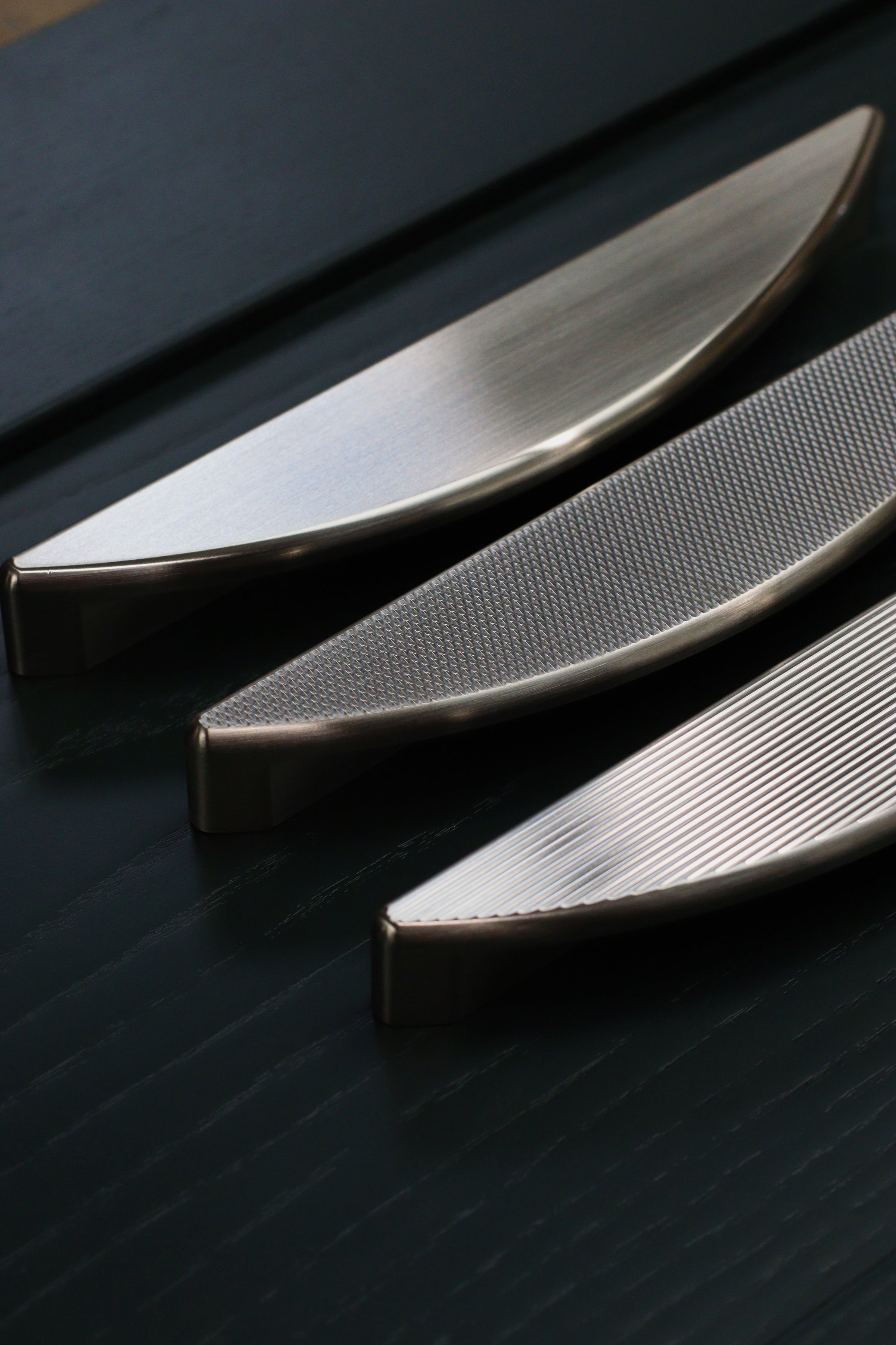 plain, knurled and fluted textured brass handles finished in satin nickel for kitchen cabinetry. photos by georgiecommonsfreelance