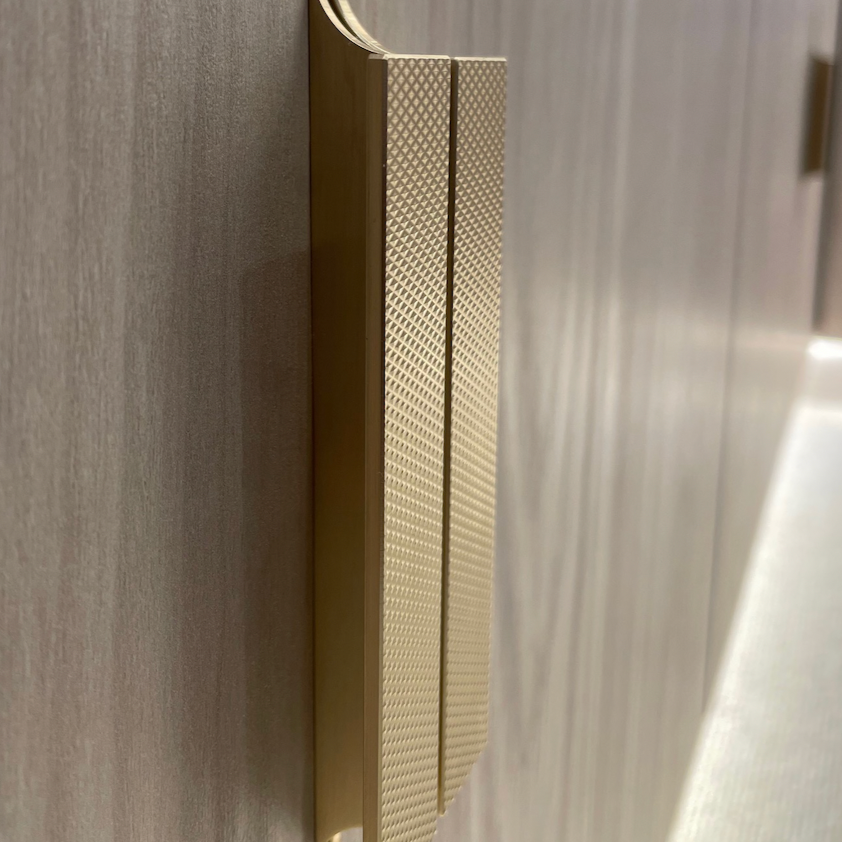 Ivychurch flat knurled pull handle in satin brass. light grey media unit Timber Roc cabinetry
